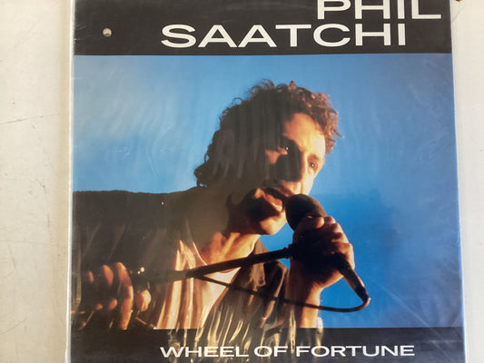 SAATCHI, PHIL = WHEEL OF FORTUNE (CDA 1987) (USED)