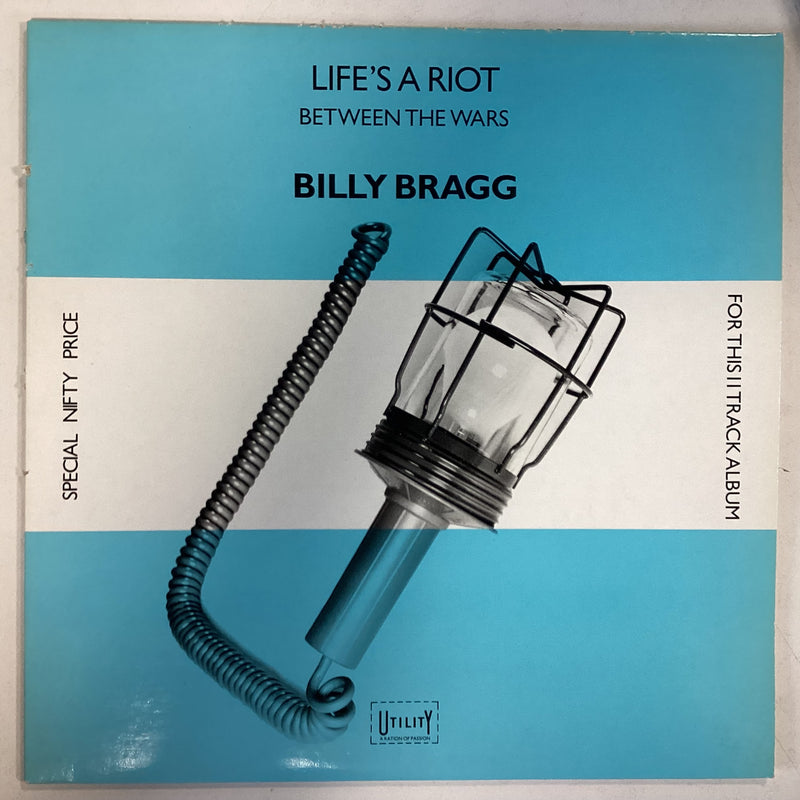 BRAGG, BILLY = LIFE’S A RIOT/BETWEEN THE WARS (CDN 1985) (USED)